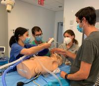 Four fellows take part in a boot camp training session